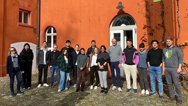 The participants of the KATE workshop posing infront of a building